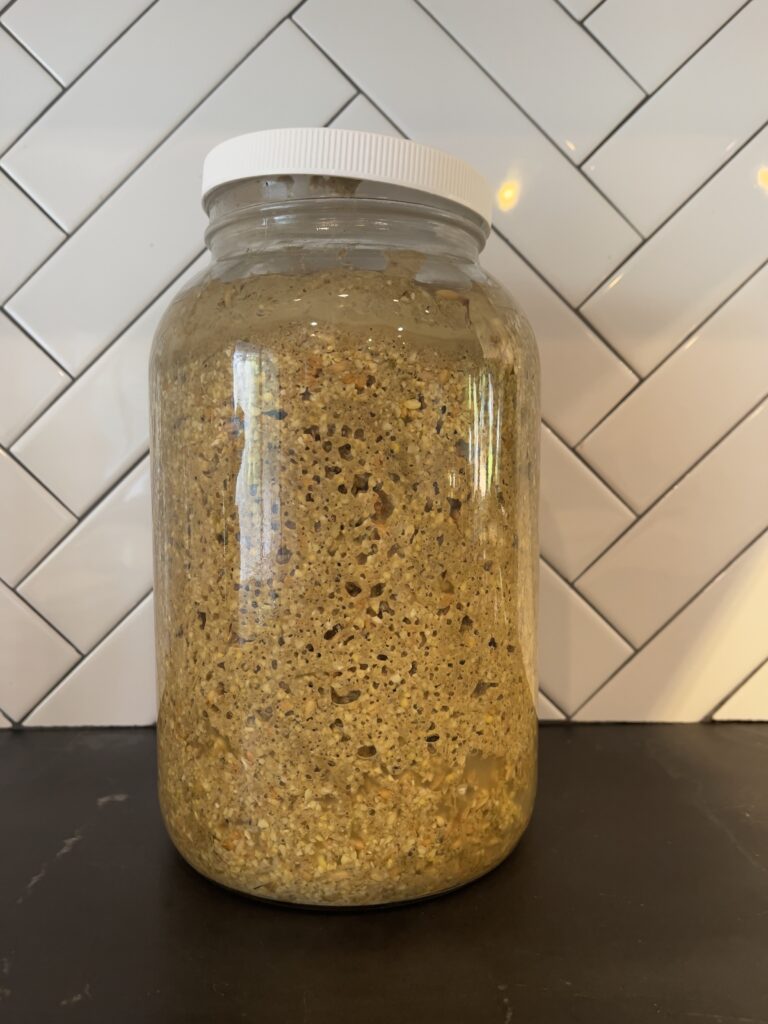 For smaller flocks, you can ferment feed in a mason jar on your kitchen counter