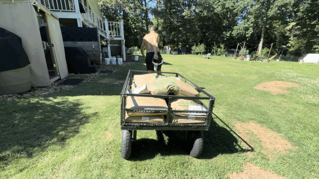 Michael hauling a few hundred pounds of chicken feed.